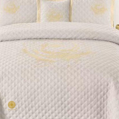 TheGharnish Paradise solid color quilted bedcover with intricate heavy embroidery, showcasing detailed stitching and vibrant fabric texture.