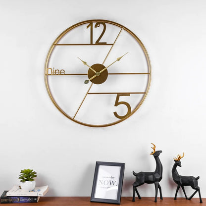 Alpha Numeric Metallic Wall Clock by TheGharnish, 24-inch diameter, modern design with bold numbers for stylish wall decor.