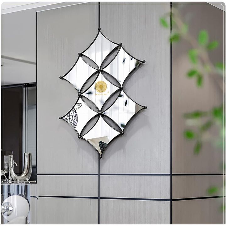 Curved rhombus metallic wall mirror by TheGharnish, 36 x 22 inches, with a sleek modern design and reflective surface.