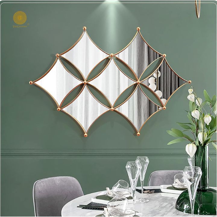 Curved rhombus metallic wall mirror by TheGharnish, 36 x 22 inches, with a sleek modern design for stylish interior decor.