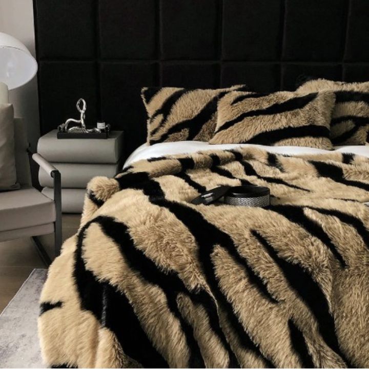 Zebra Print Faux Fur Blanket Set. Crafted with ultra-soft, high-density faux fur, this blanket brings a bold and exotic flair to your space with its striking black and white zebra pattern.