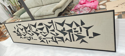 Decorative wall art with geometric pattern on a white surface
