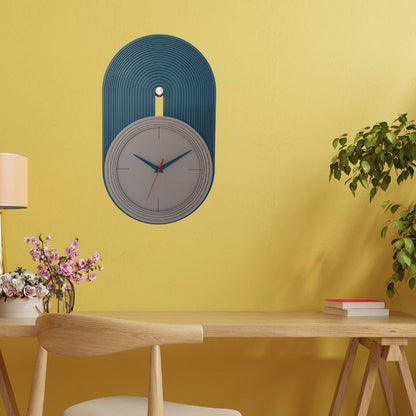 Elevate your home decor with our Modern Nordic Wall Clock, a perfect blend of minimalist design and functional elegance. Featuring a matte grey dial set against a teal blue arched panel with fine grooves, this clock adds a contemporary touch to any living room, bedroom, or office space. The sleek blue and red hands ensure precise timekeeping,deal for lovers of Scandinavian and modern aesthetics.