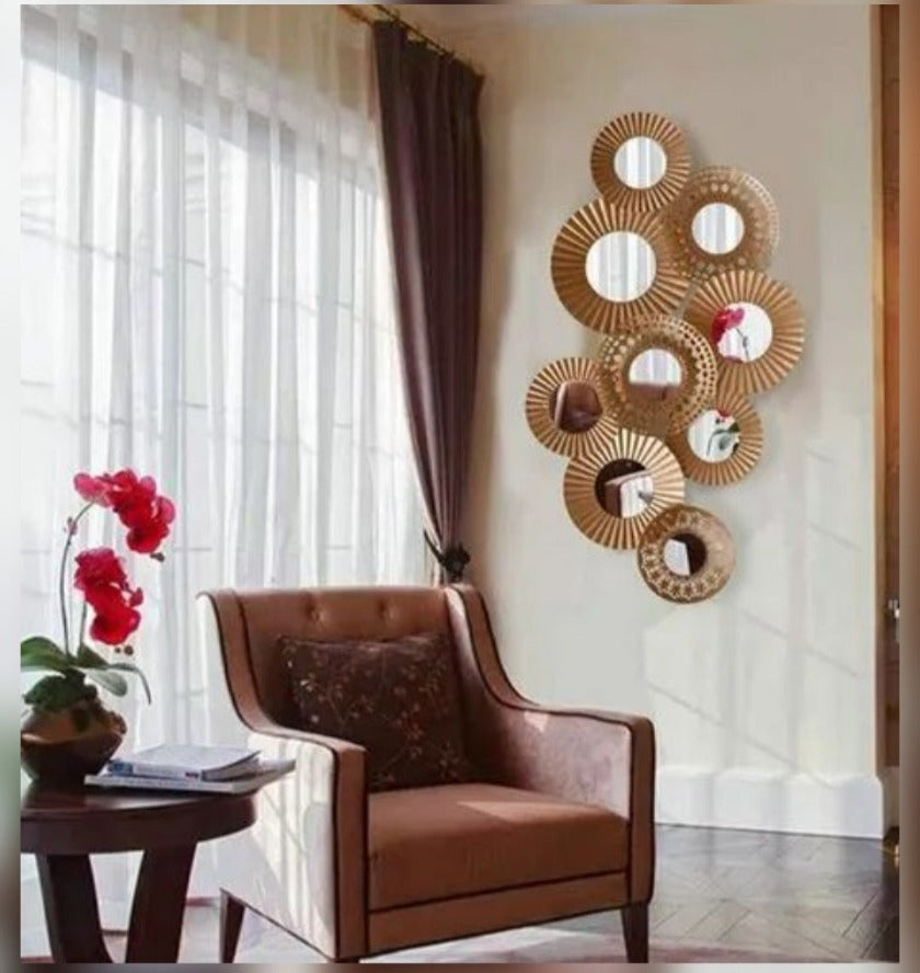 Metallic wall art featuring nine iron rings in a modern design, measuring 48x23 inches, by The Gharnish.
