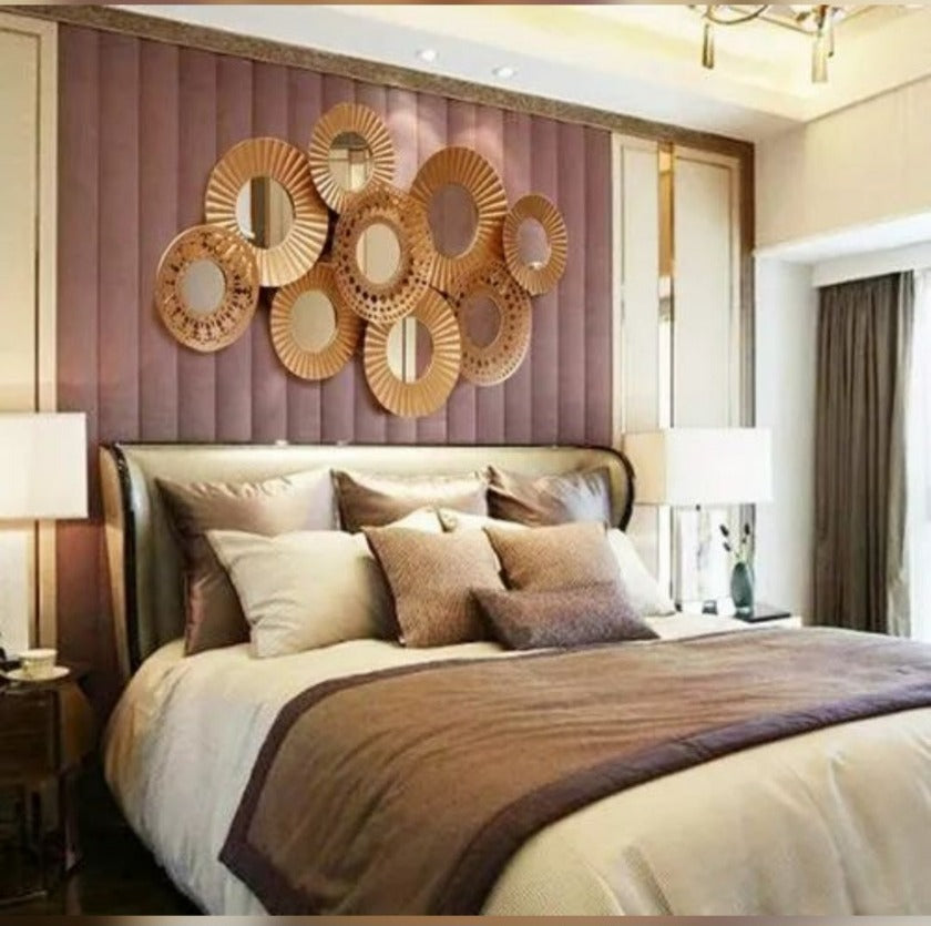 Metallic wall art featuring 9 iron rings in a modern design, measuring 48 x 23 inches, by The Gharnish.