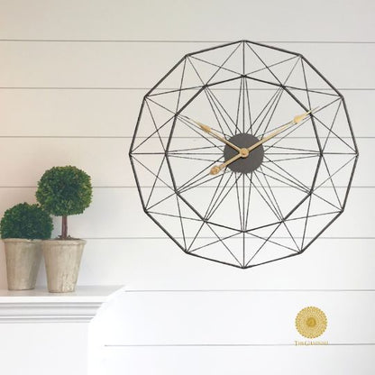 The Gharnish geometrical designs wall clock, 30-inch diameter, featuring modern geometric patterns and a sleek black finish.