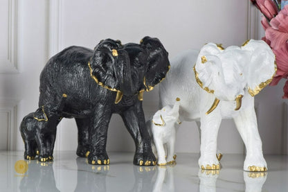 Black elephant figurine with a baby elephant, crafted by TheGharnish, detailed animal figurine for home decor or collection.