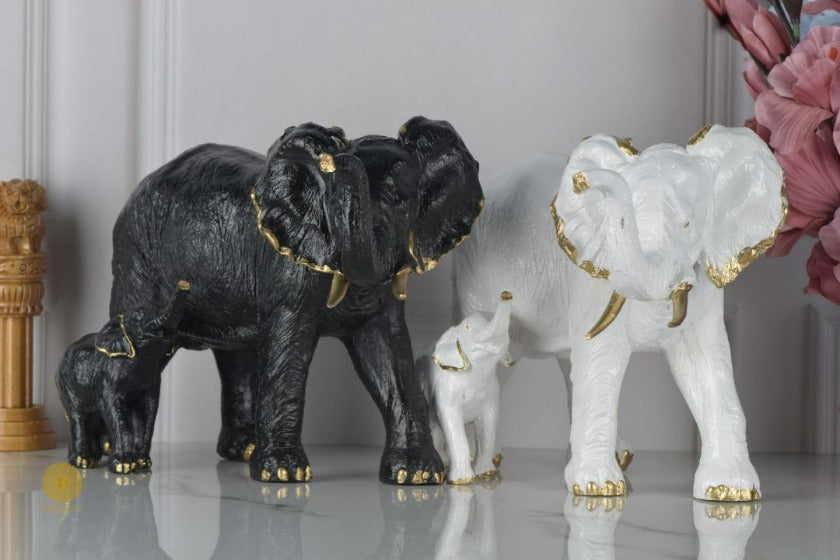 Black elephant figurine with a baby elephant, detailed animal sculpture from TheGharnish animal figurines collection.
