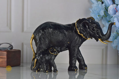 Black elephant figurine with a baby elephant, detailed animal sculpture by TheGharnish, showcasing realistic features and craftsmanship.