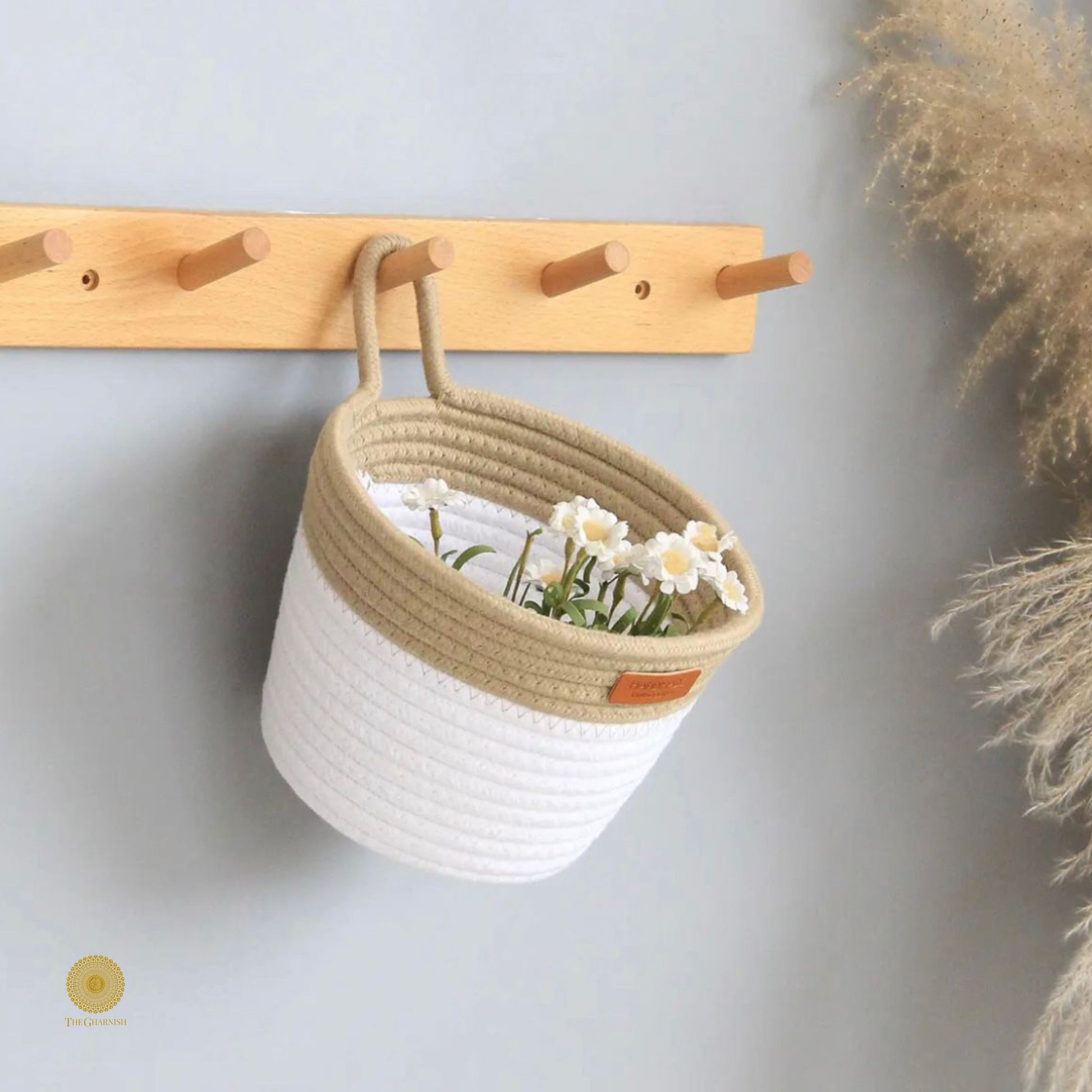 White and brown wall hanging basket by TheGharnish, showcasing a woven basket design ideal for wall decor or storage.