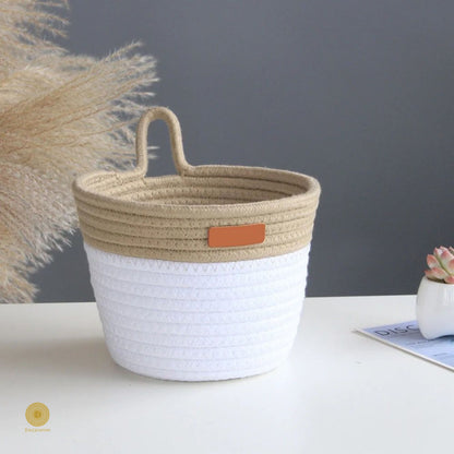 White and brown wall hanging basket by TheGharnish, woven basket with handles suitable for wall decor and storage.