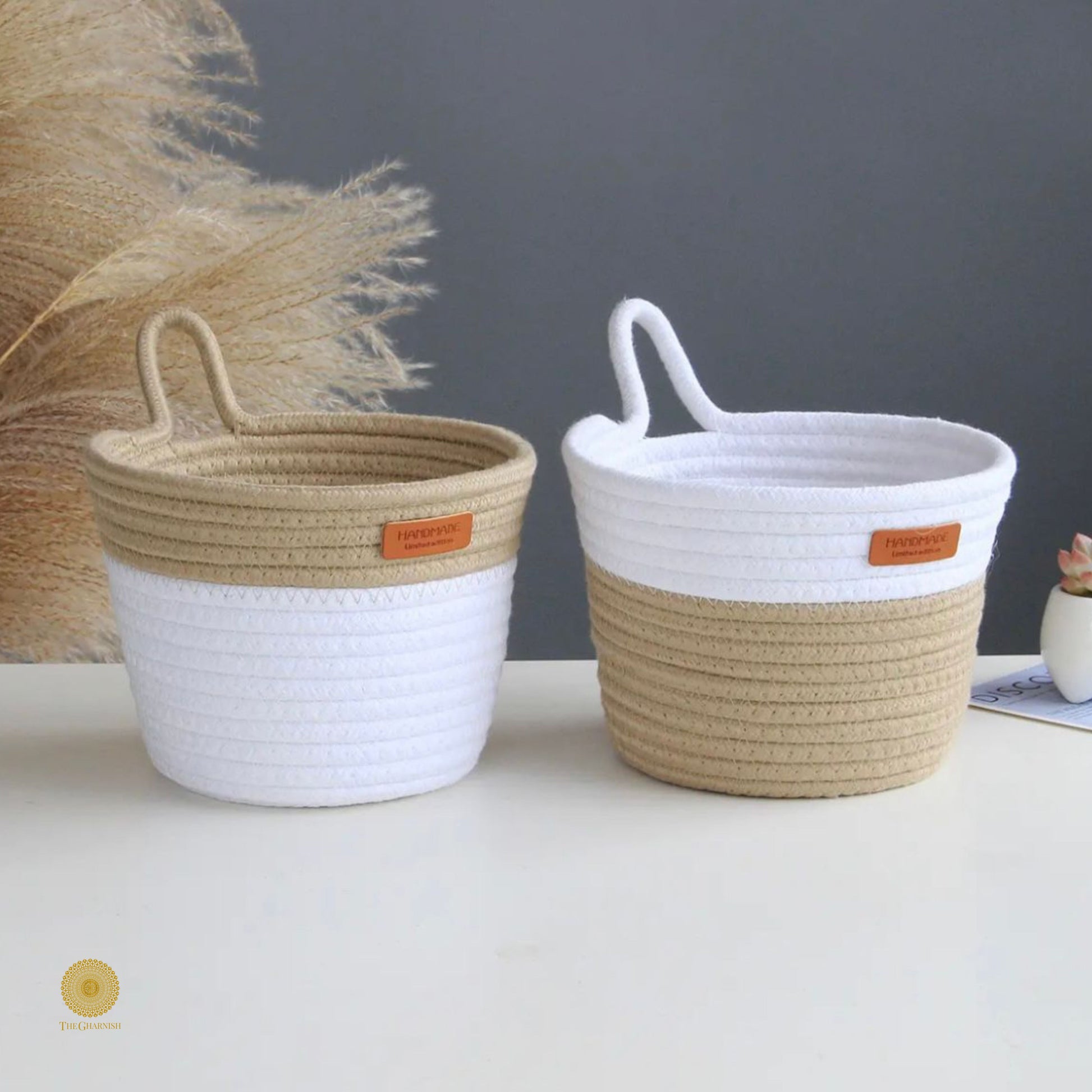 White and brown wall hanging basket by TheGharnish, crafted from woven material, ideal for storage or decorative use.
