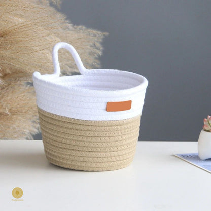 White and brown woven wall hanging basket by TheGharnish, showcasing its decorative and functional design for wall storage.