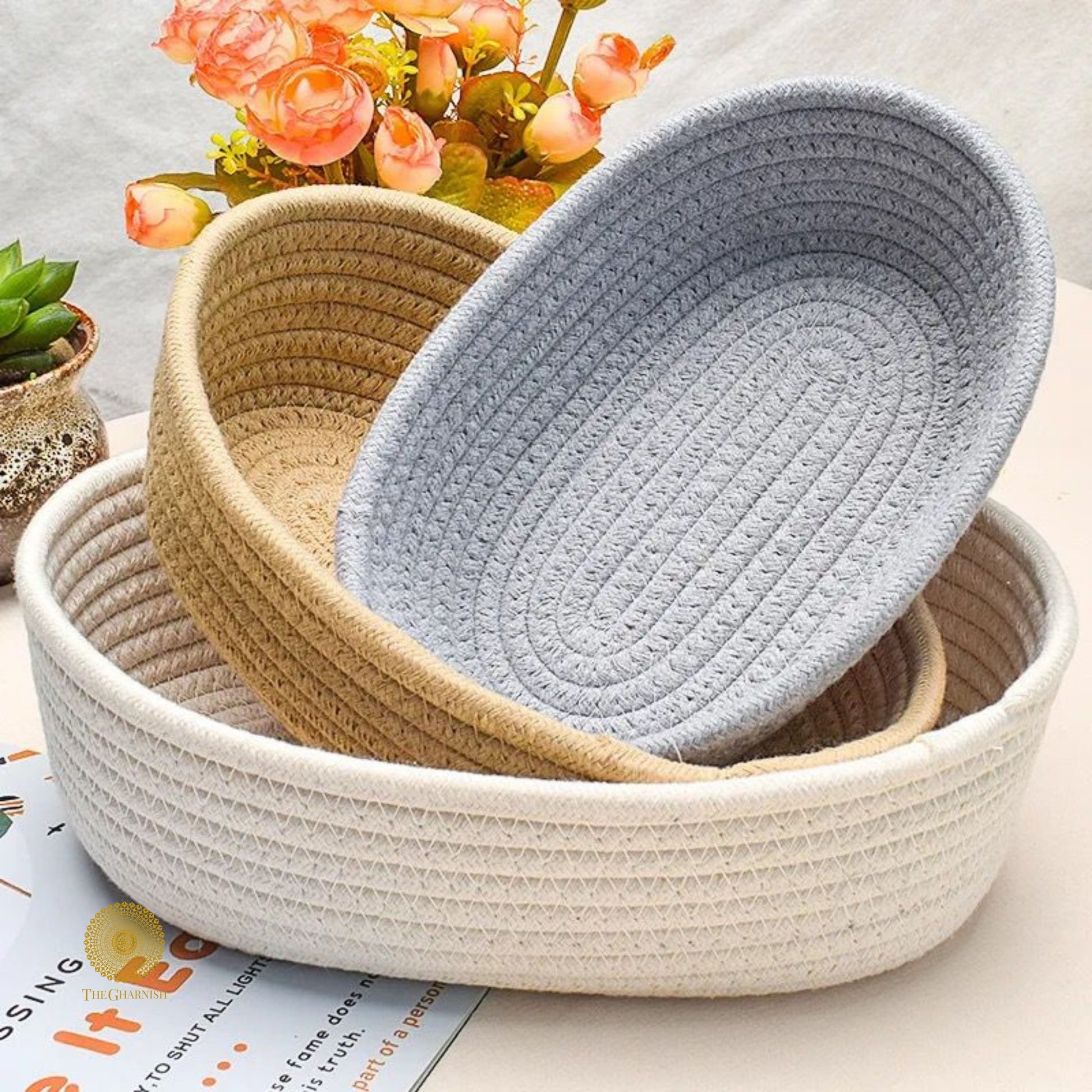 Set of three white storage organizer baskets by TheGharnish, ideal for decluttering and organizing household spaces.