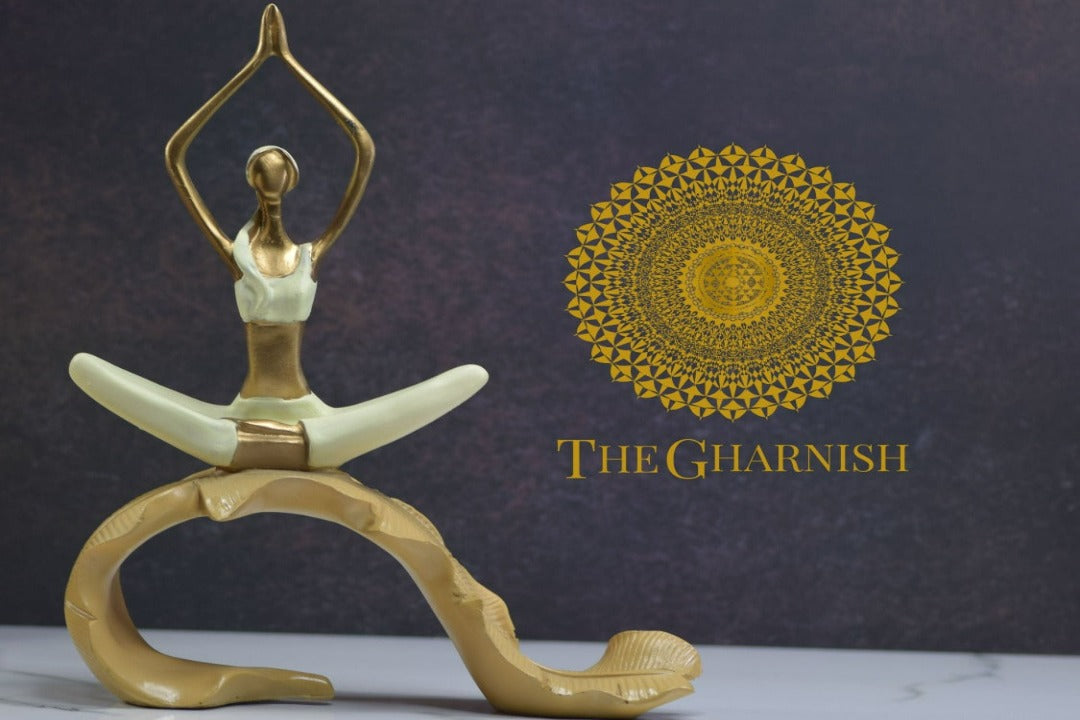 TheGharnish yoga figurine of a lady practicing yoga on a banana leaf, detailed and decorative ceramic sculpture.