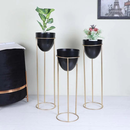 Set of 3 egg-shaped metallic planters in 26, 22, and 18 inches with a shiny finish, designed by TheGharnish.