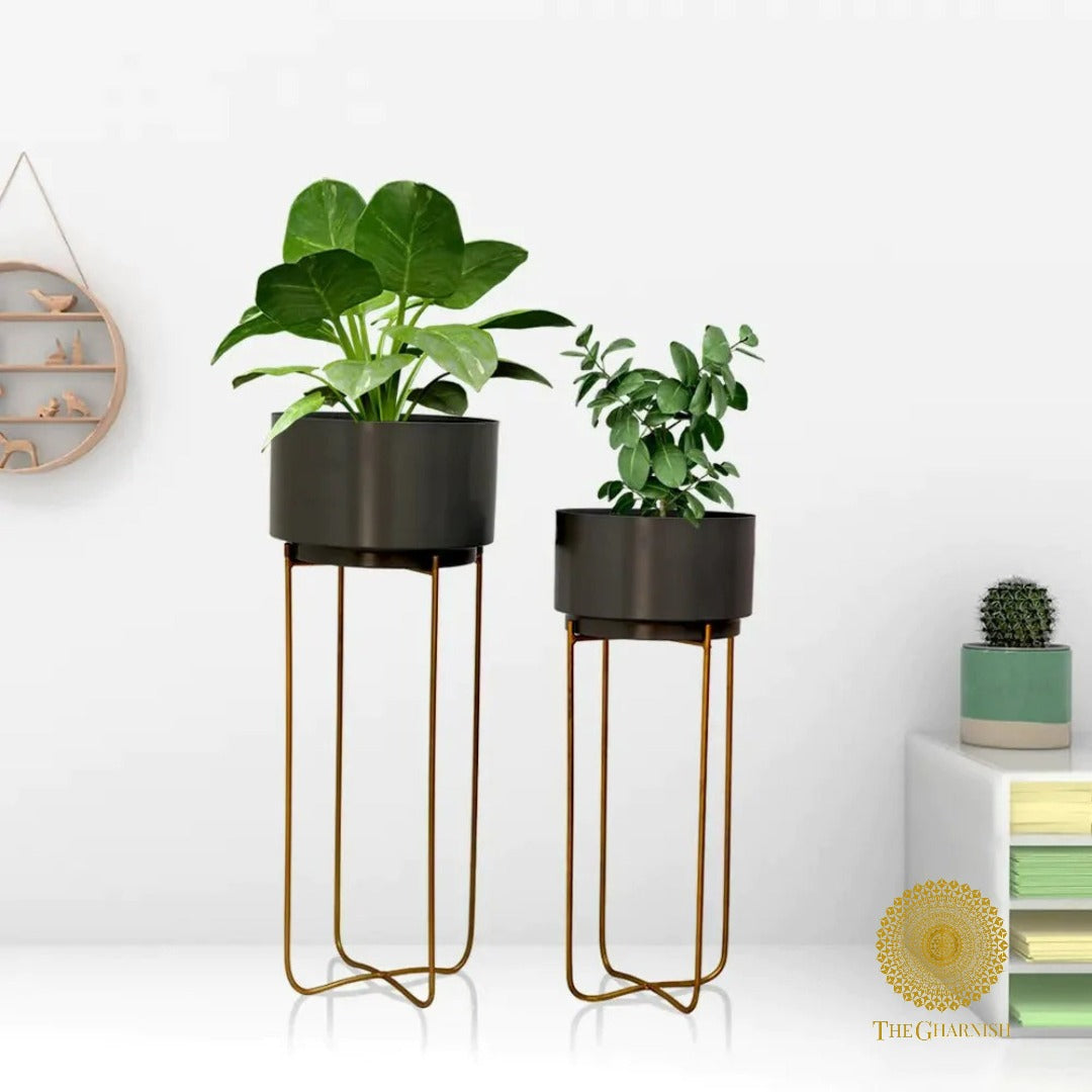 Set of two pink round planet-shaped planters with cross metal stands by TheGharnish, modern decorative plant containers