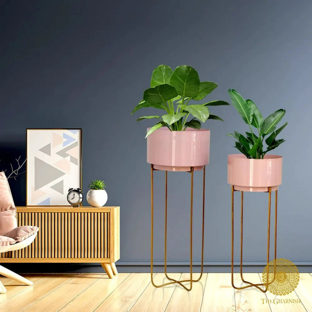 Set of two pink round planet planters with cross metal stands by TheGharnish, decorative and stylish indoor plant holders.