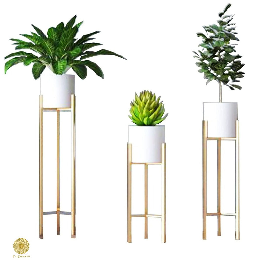Set of three white planters with stands in 33, 25, and 18 inches by TheGharnish, featuring modern ceramic design.