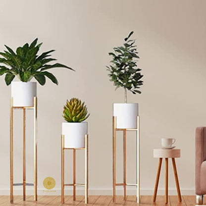 Set of three white planter pots with stands in 33, 25, and 18 inches tall by TheGharnish, ideal for indoor or outdoor decor.