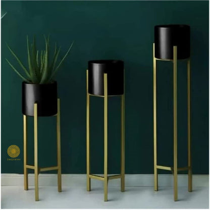 Set of three white planter pots with stands in 33, 25, and 18 inches by TheGharnish, ideal for indoor or outdoor plants.