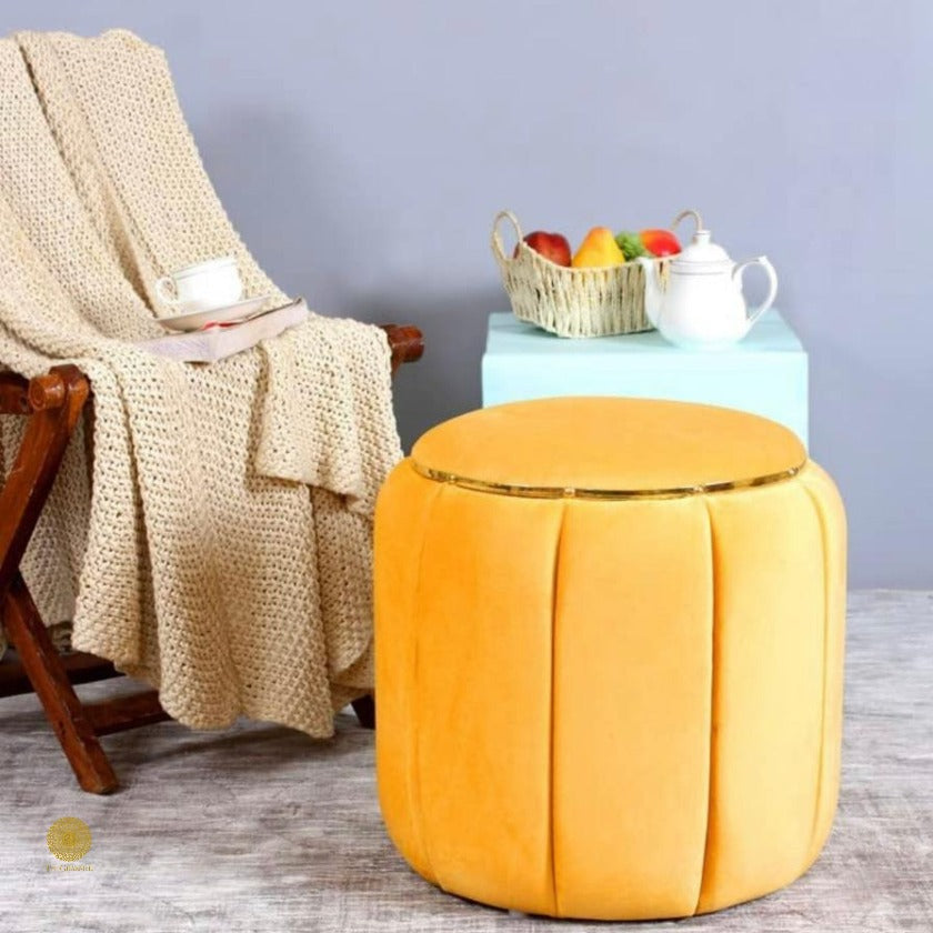 Brown pouf sitting stool from TheGharnish, designed as a dressing table sitting stool with soft upholstery and round shape.