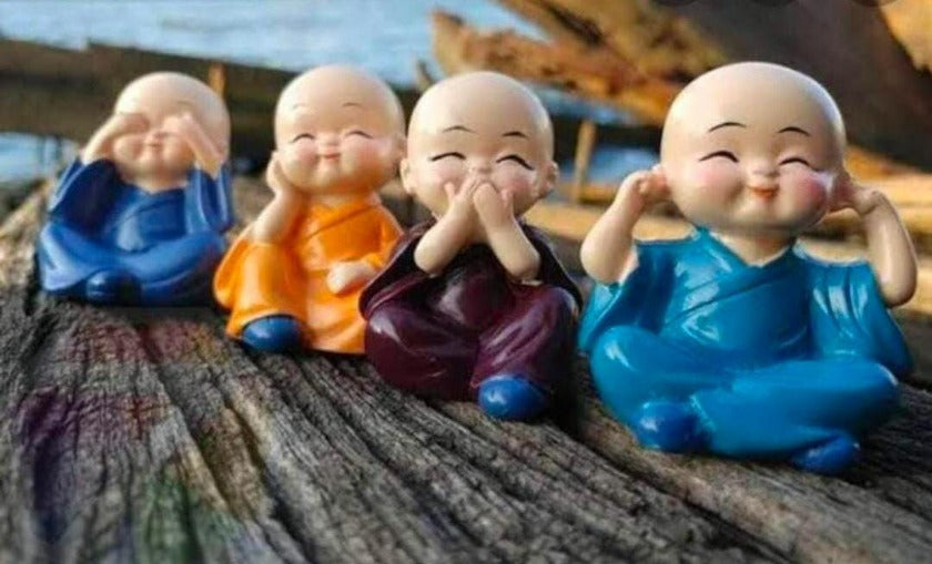 Set of four Baby Monk table top decor showpieces by TheGharnish, featuring intricate handcrafted monk figurines for home decoration.