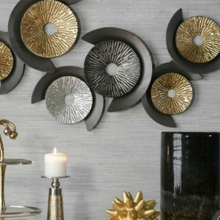 Six metallic magnetic wheels wall art by TheGharnish, 48 x 22 inches, featuring a modern design on a wall.