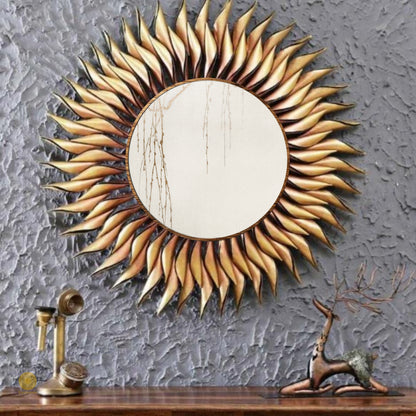 Metallic sun wall mirror by TheGharnish, 36-inch round wall art with a shiny sunburst design reflecting light.