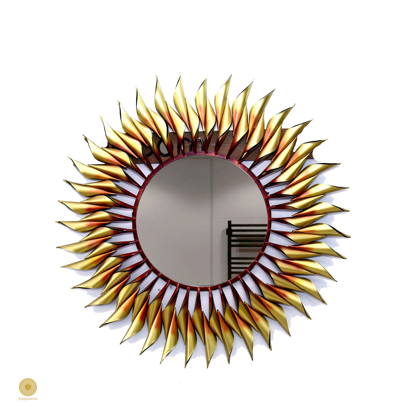 Metallic sun wall mirror by TheGharnish, 36-inch round wall art with a radiant sun design, reflective surface and decorative frame.