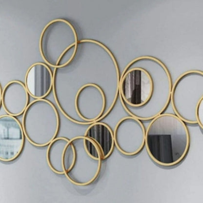 The Gharnish Bunch of Rings wall mirror, 48x24 inches, featuring multiple round ring designs in a modern wall decor style.